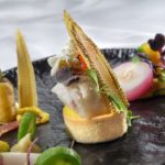 Kreation beim HUG-Wettbewerb 2018 mit Maiscreme, Rotbarsch und Safran. Foto: HUG